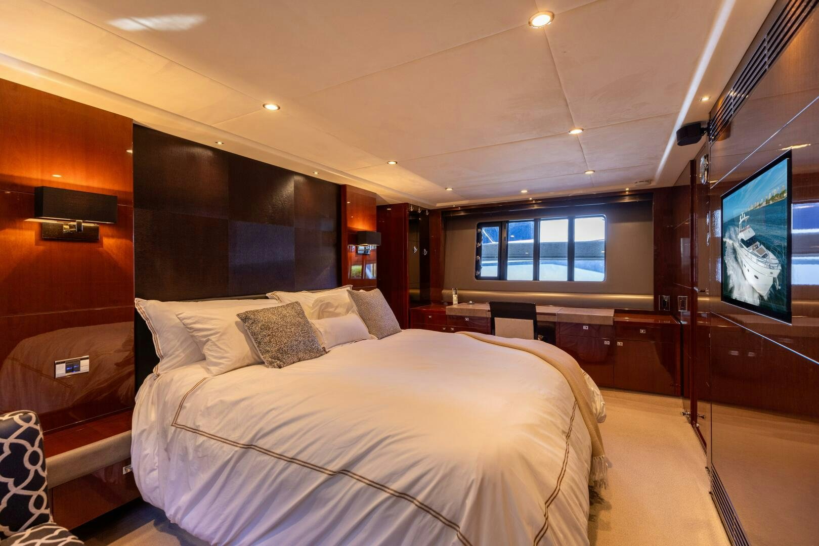 a room with a bed and a television aboard MISS DORI Yacht for Sale
