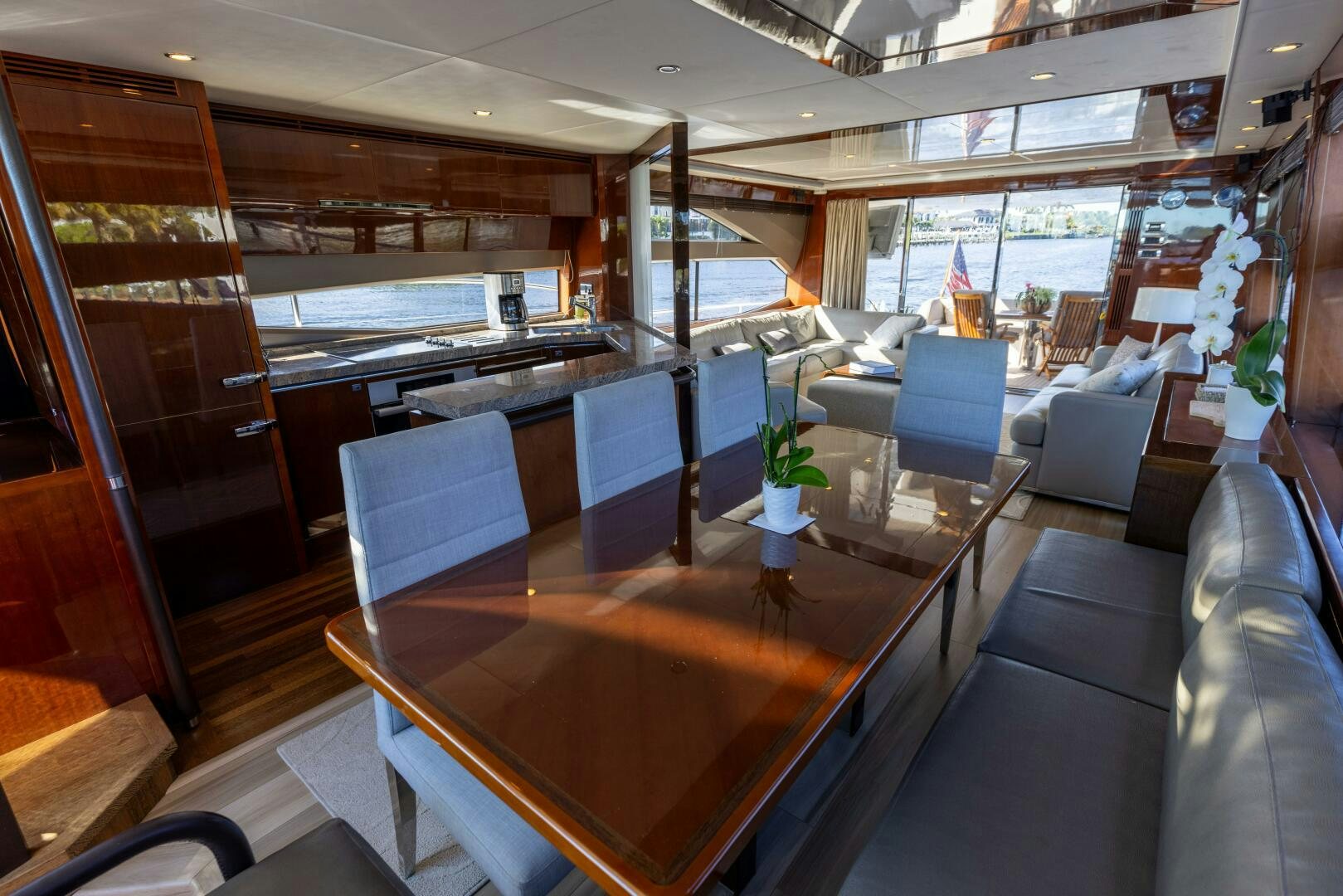 a room with a table and chairs aboard MISS DORI Yacht for Sale