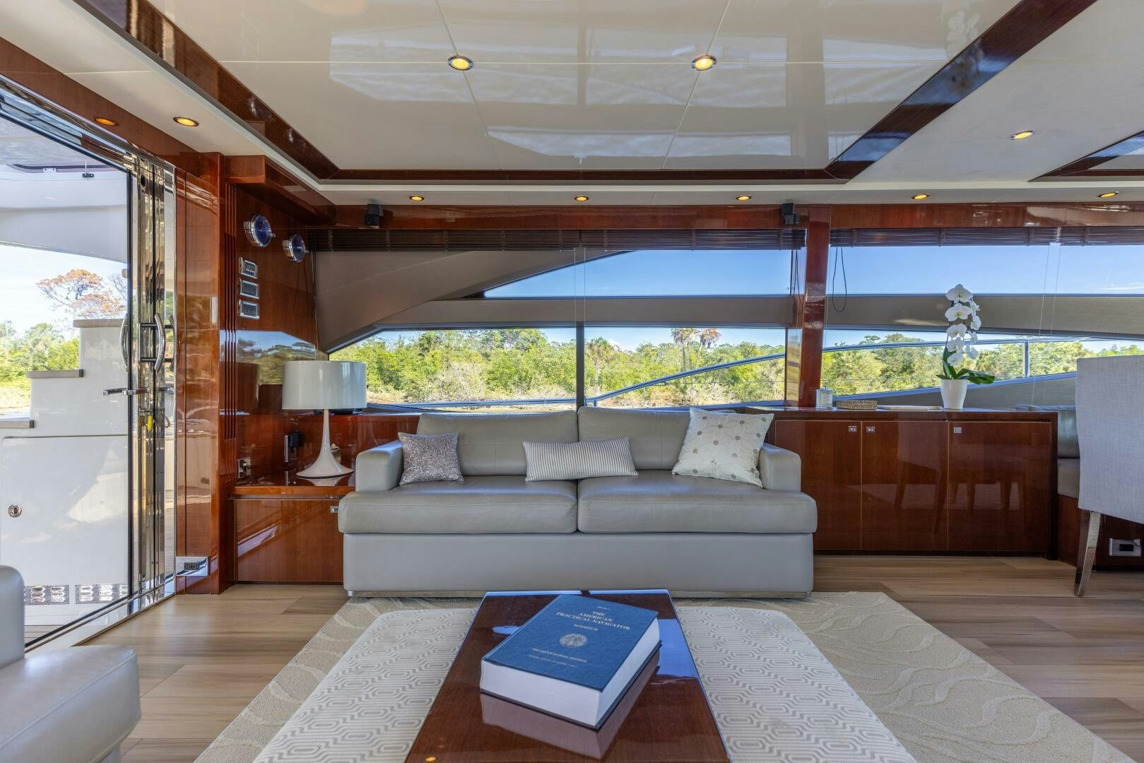 a living room with a large window aboard MISS DORI Yacht for Sale
