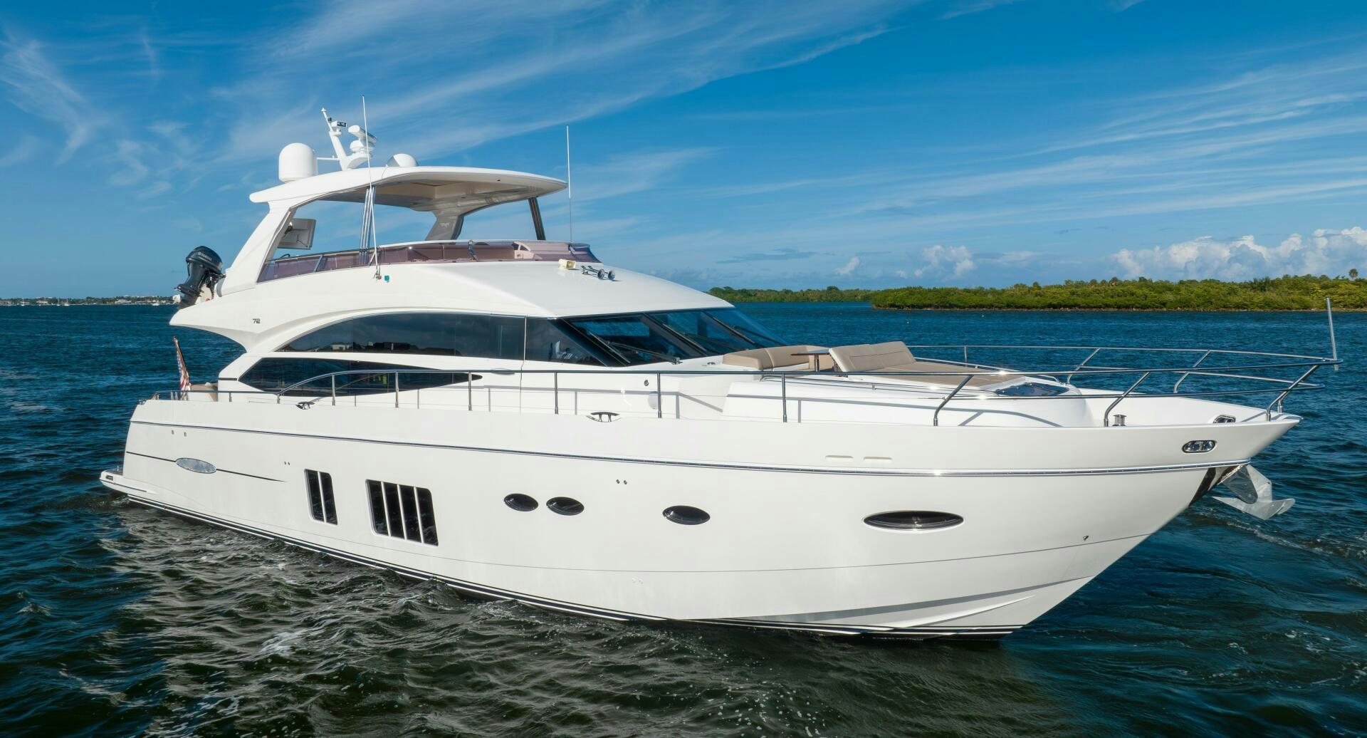 a white yacht on the water aboard MISS DORI Yacht for Sale