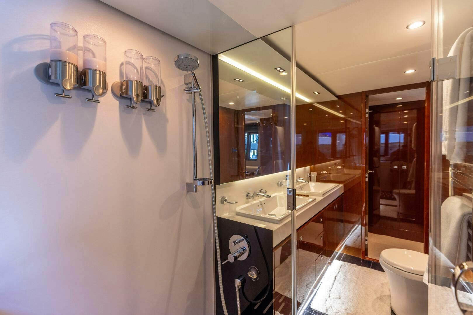 a bathroom with a glass shower aboard MISS DORI Yacht for Sale