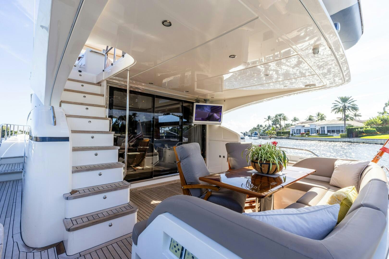 a room with a couch and a table and a television aboard MISS DORI Yacht for Sale