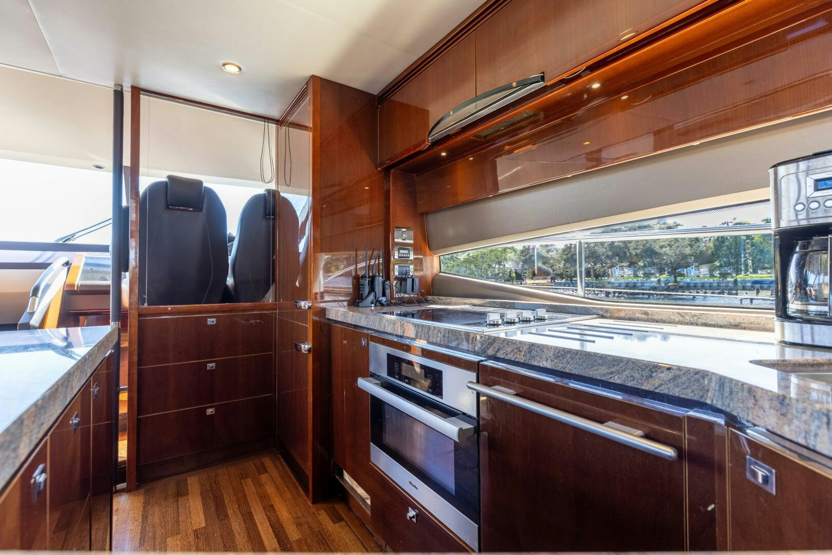 a kitchen with wooden cabinets aboard MISS DORI Yacht for Sale