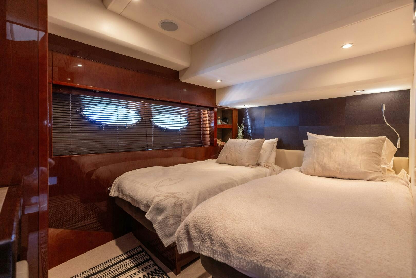 a room with two beds aboard MISS DORI Yacht for Sale