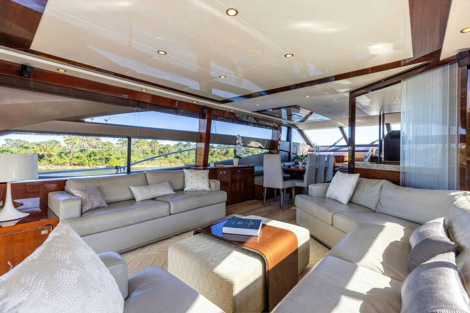 a living room with a large window aboard MISS DORI Yacht for Sale