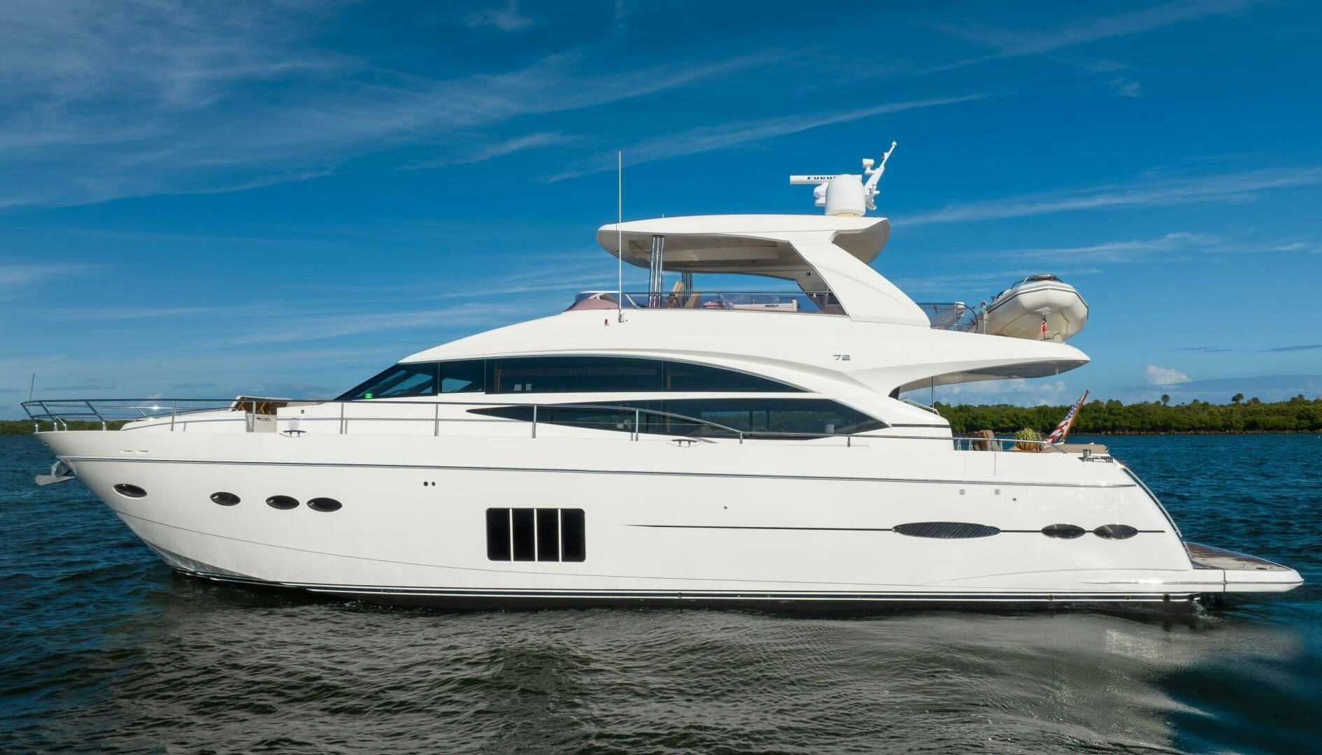 a white yacht on the water aboard MISS DORI Yacht for Sale