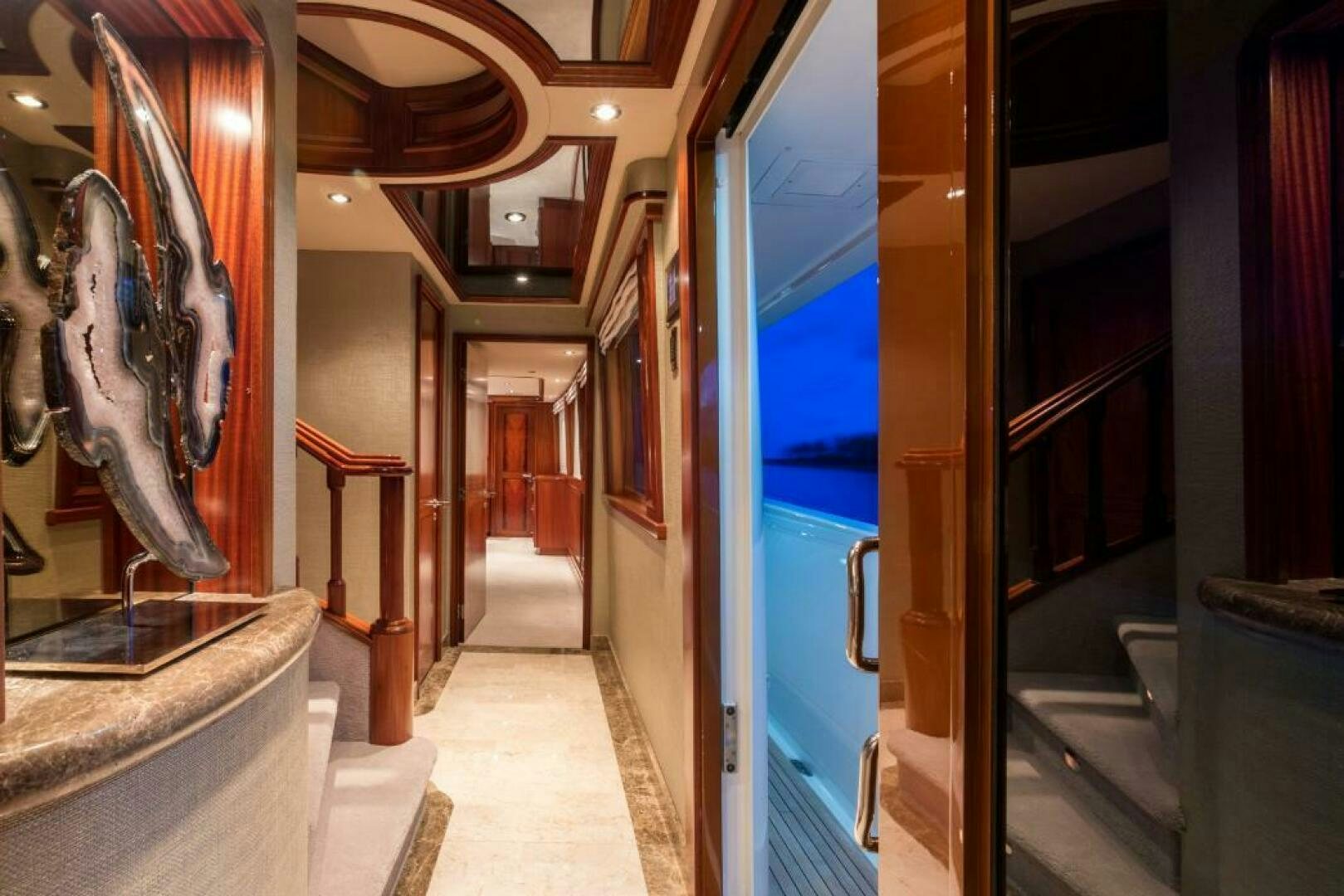 a hallway with statues aboard TRUST FUN Yacht for Sale