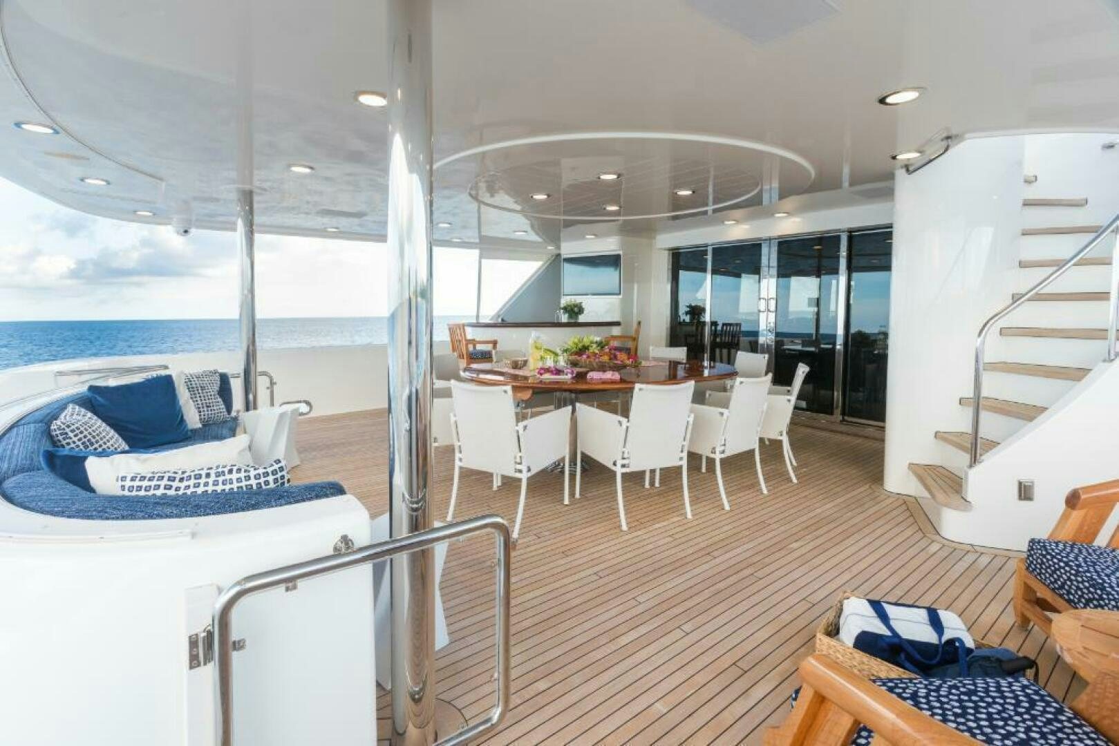 a room with a table chairs and a large window aboard TRUST FUN Yacht for Sale