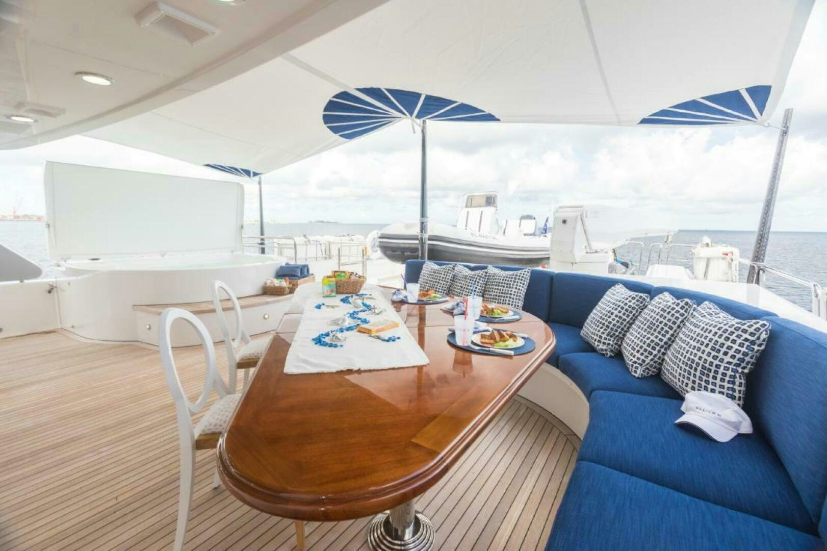 a table and chairs on a boat aboard TRUST FUN Yacht for Sale