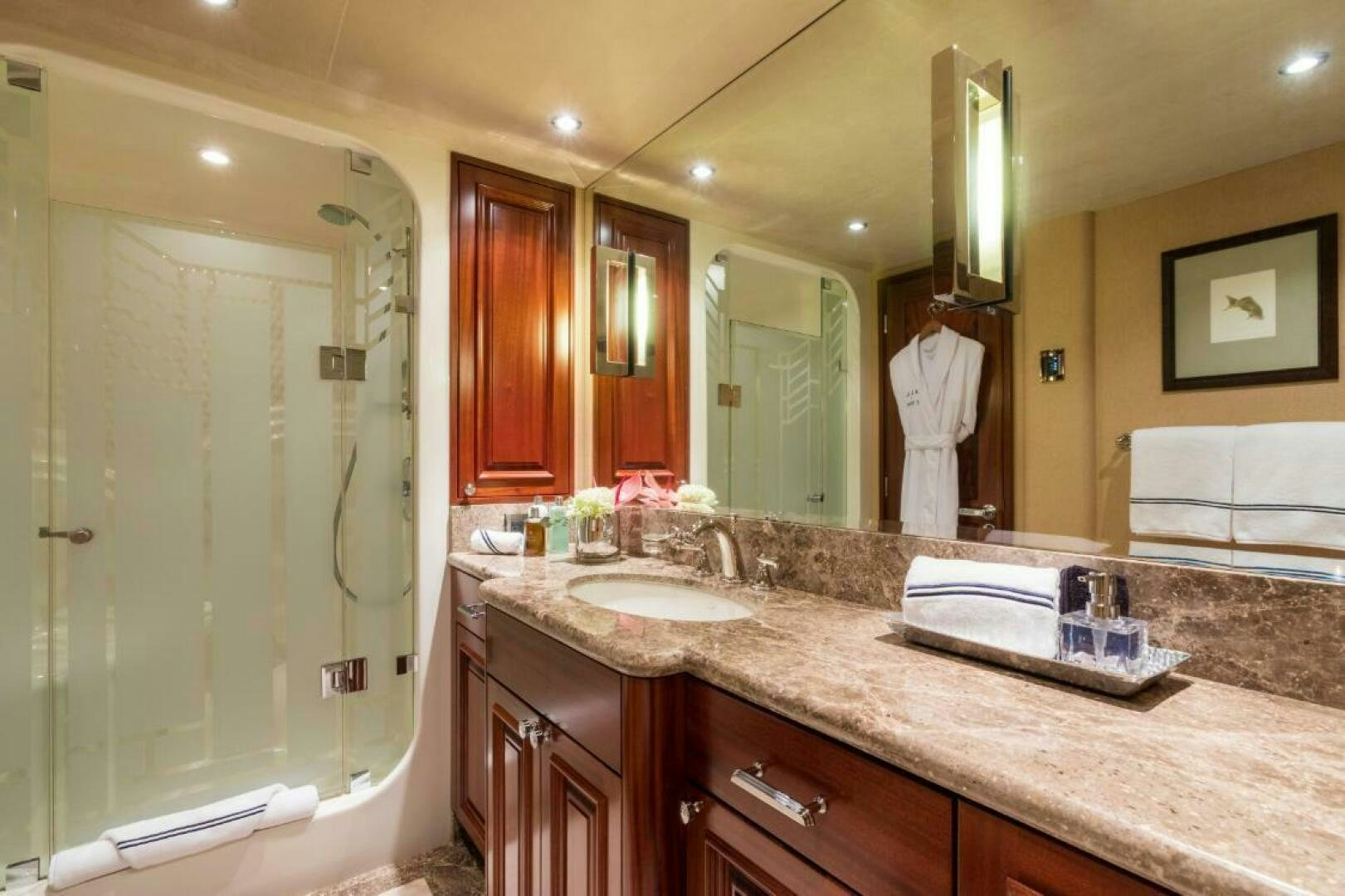 a bathroom with a large mirror aboard TRUST FUN Yacht for Sale