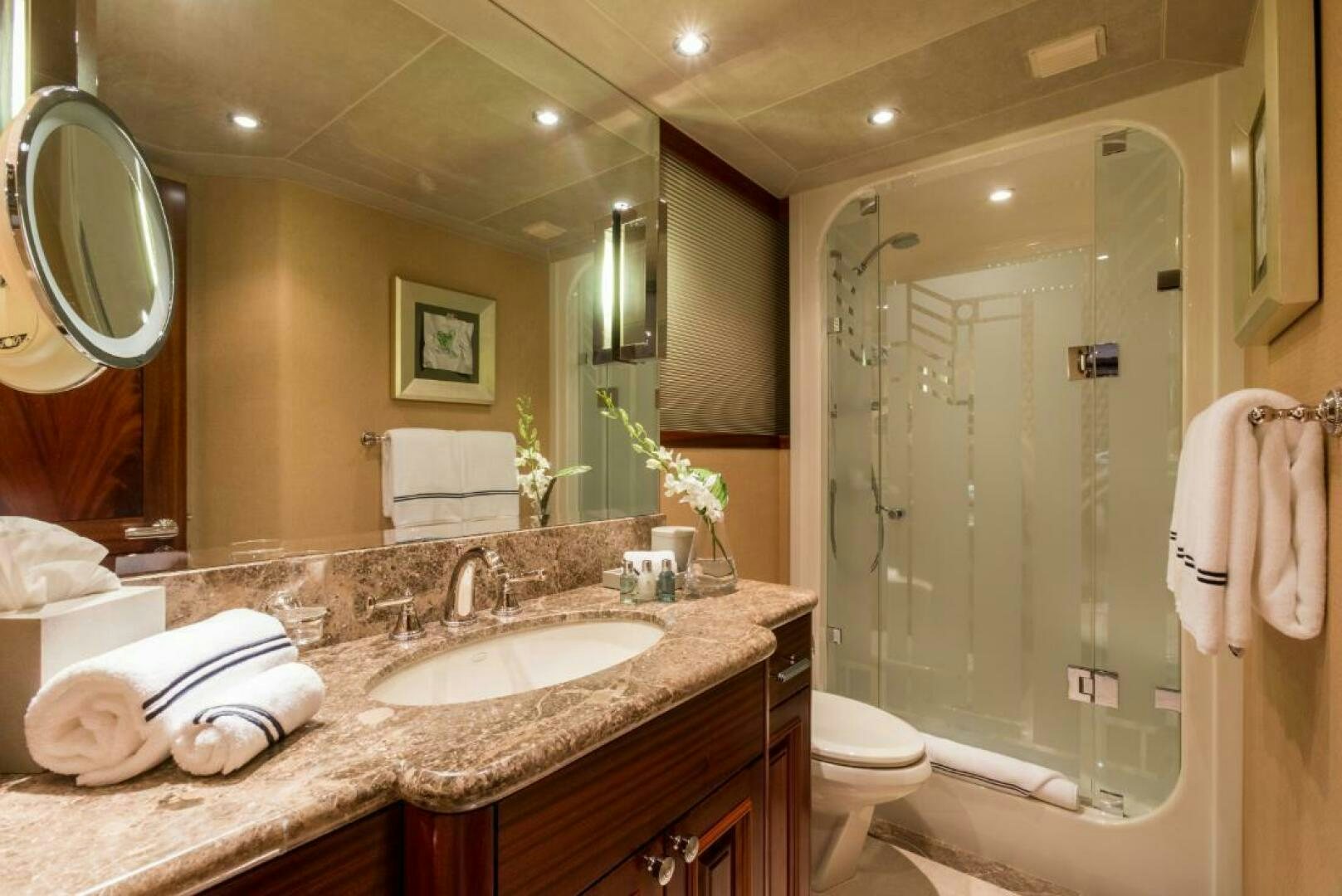 a bathroom with a large mirror aboard TRUST FUN Yacht for Sale