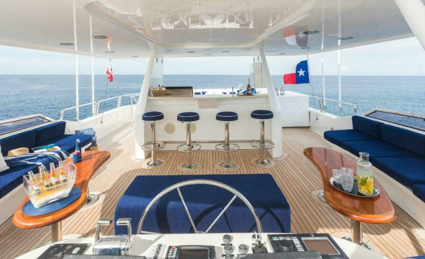 a boat with a table and chairs aboard TRUST FUN Yacht for Sale