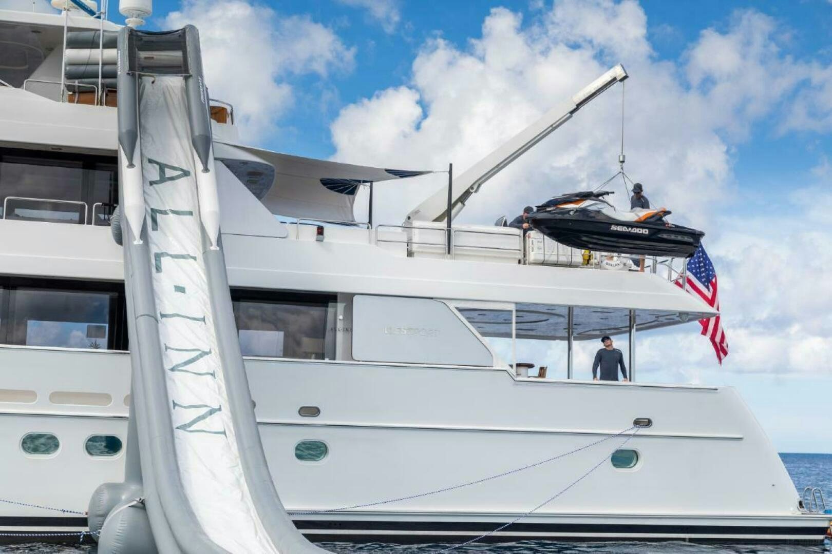 a boat with a flag on the front aboard TRUST FUN Yacht for Sale