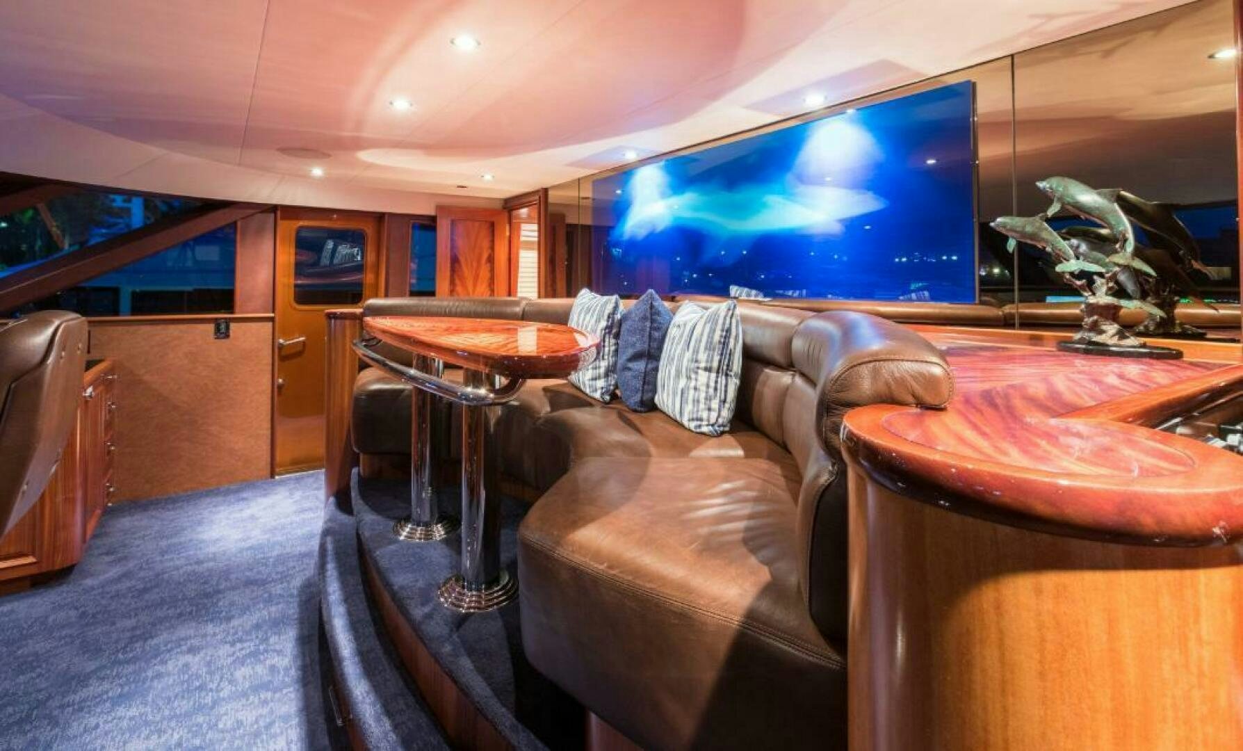a room with a tv and furniture aboard TRUST FUN Yacht for Sale