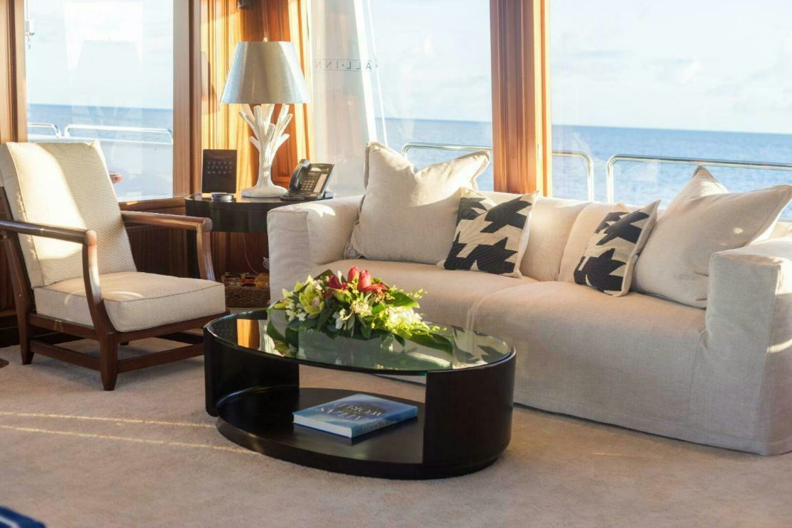a living room with a couch and a coffee table aboard TRUST FUN Yacht for Sale