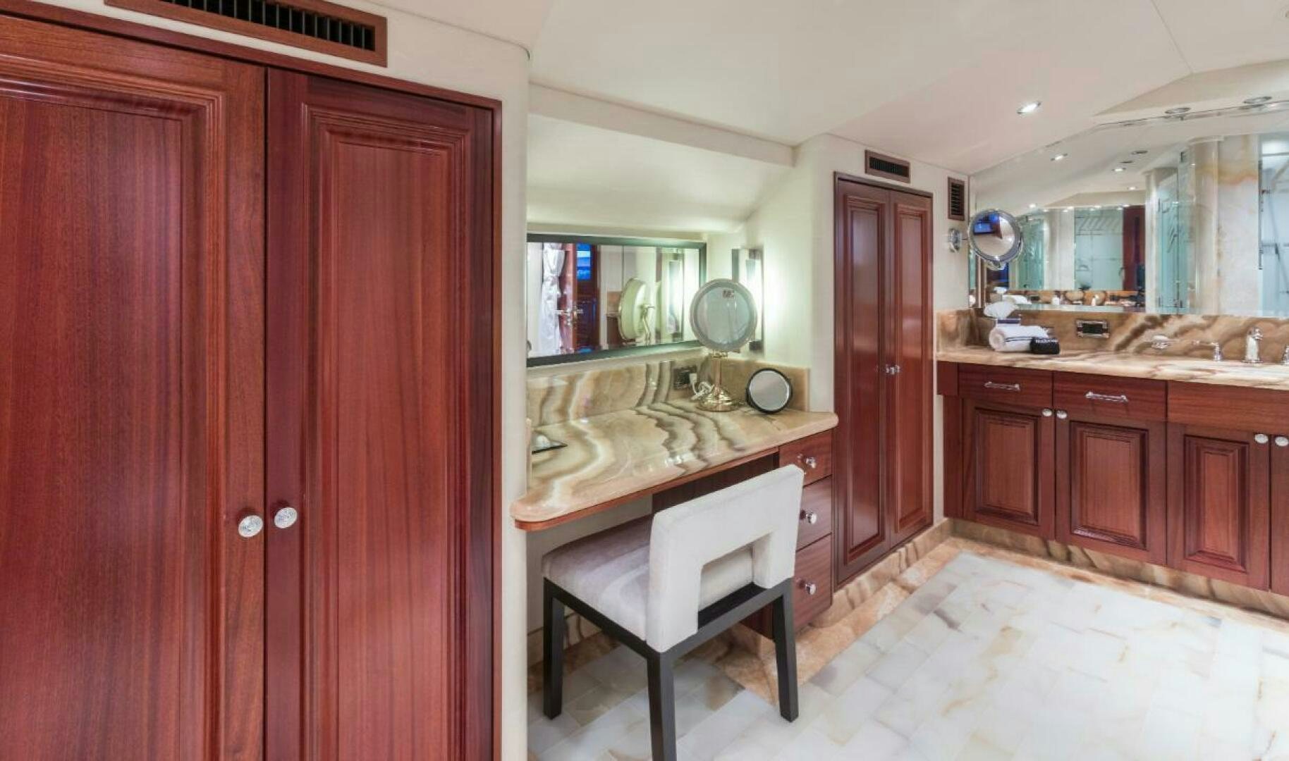 a bathroom with a sink and cabinets aboard TRUST FUN Yacht for Sale
