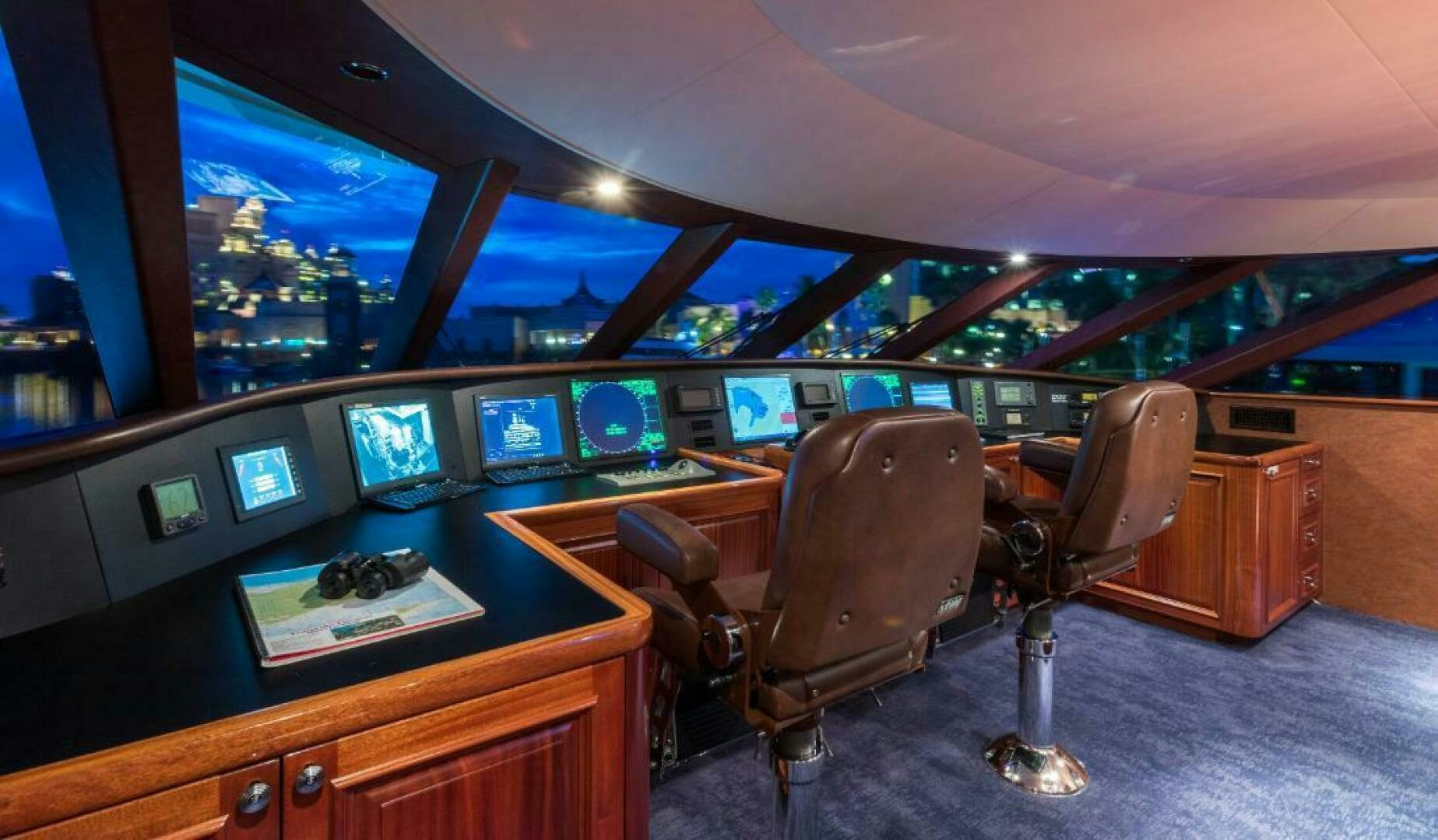 a chair in front of a desk with a computer on it aboard TRUST FUN Yacht for Sale