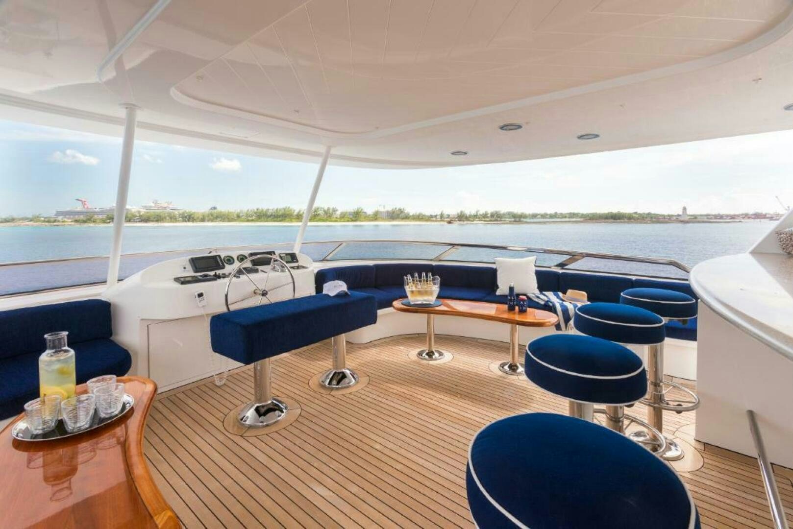 a room with a table and chairs aboard TRUST FUN Yacht for Sale