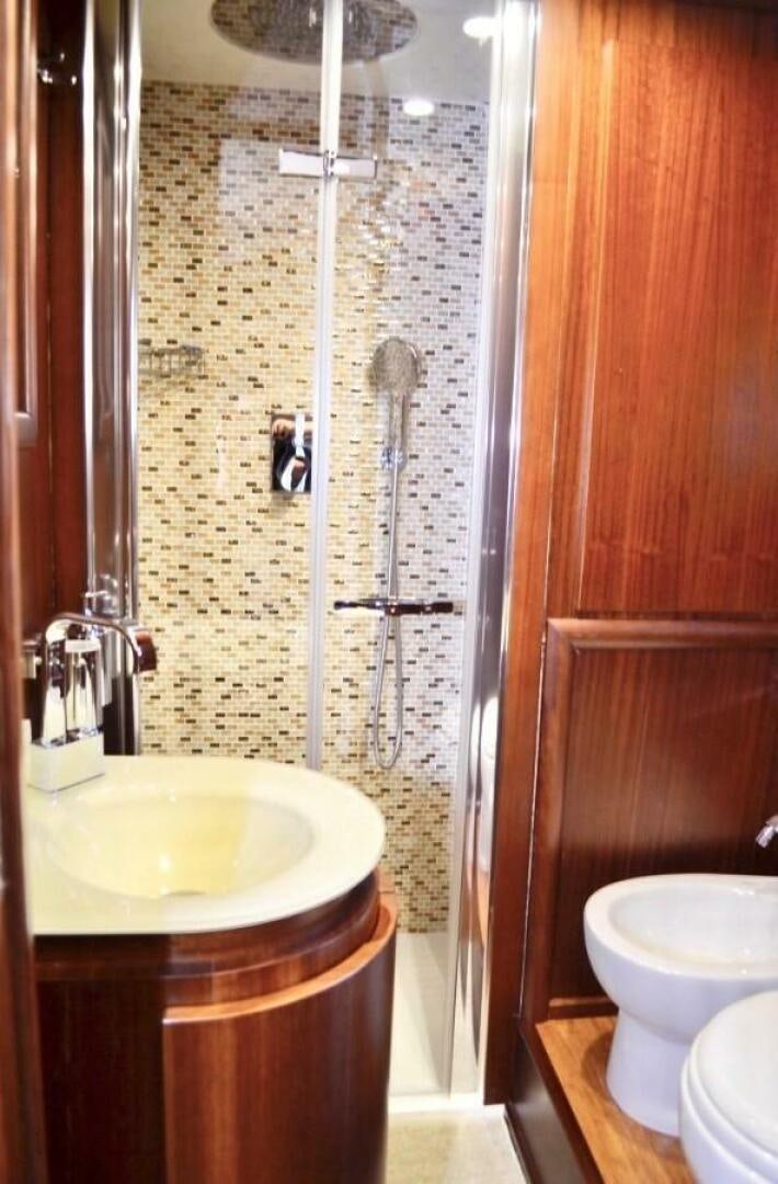 a bathroom with a sink and a shower aboard MARILOAN FELNIC II Yacht for Sale
