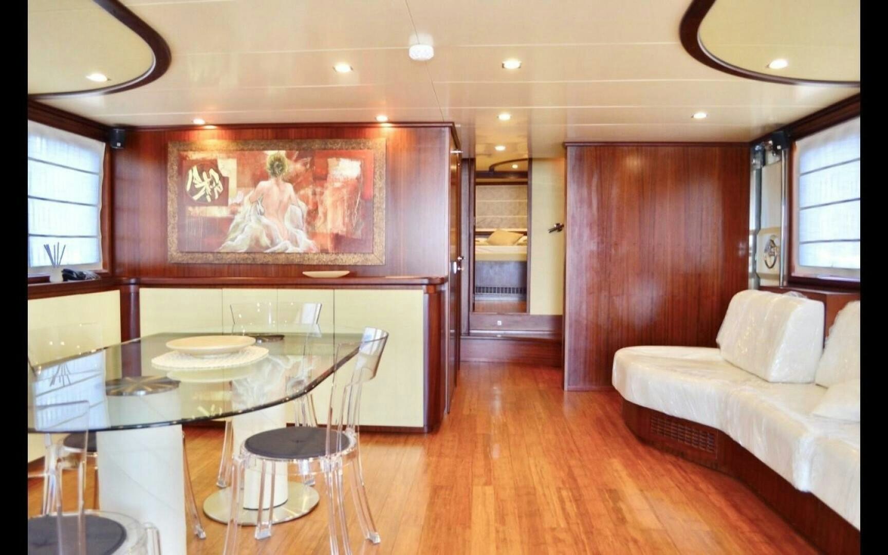 a living room with a wood floor aboard MARILOAN FELNIC II Yacht for Sale