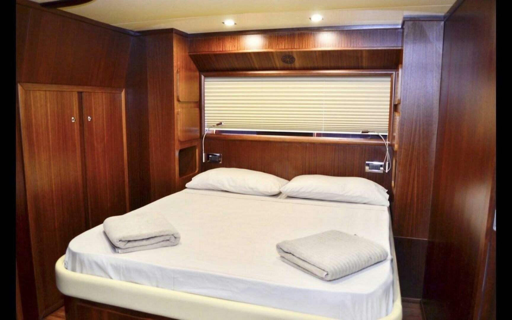 a bed with white sheets aboard MARILOAN FELNIC II Yacht for Sale