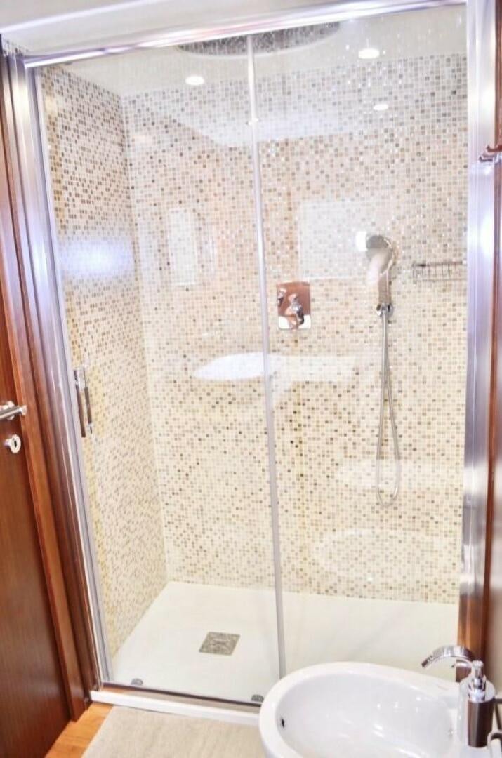 a bathroom with a shower unit and sink aboard MARILOAN FELNIC II Yacht for Sale