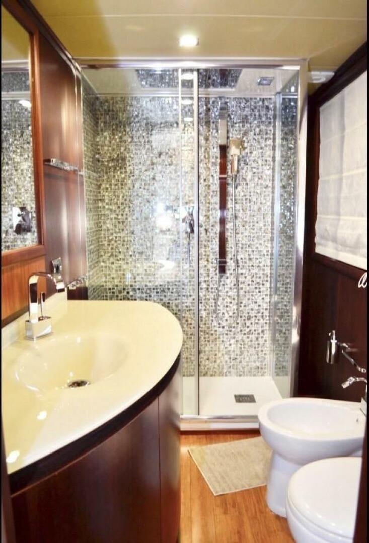 a bathroom with a shower curtain aboard MARILOAN FELNIC II Yacht for Sale