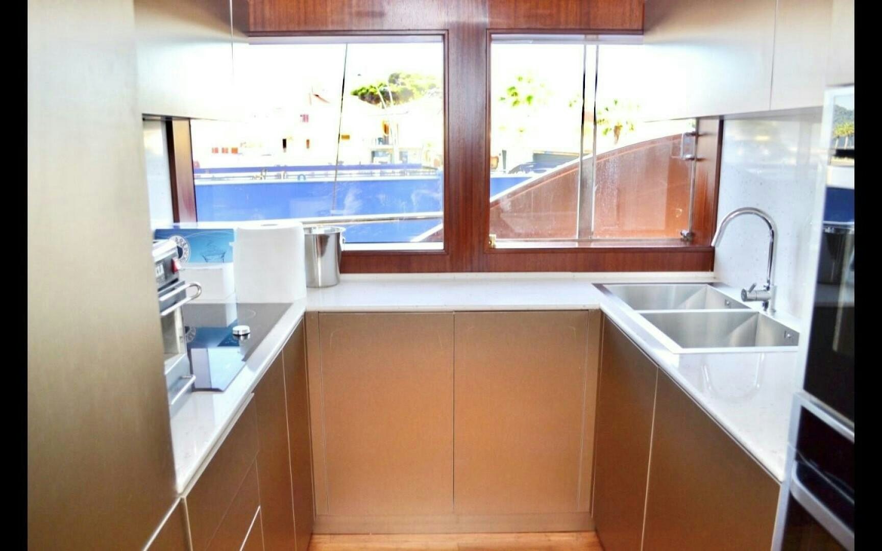 a kitchen with a sink and cabinets aboard MARILOAN FELNIC II Yacht for Sale