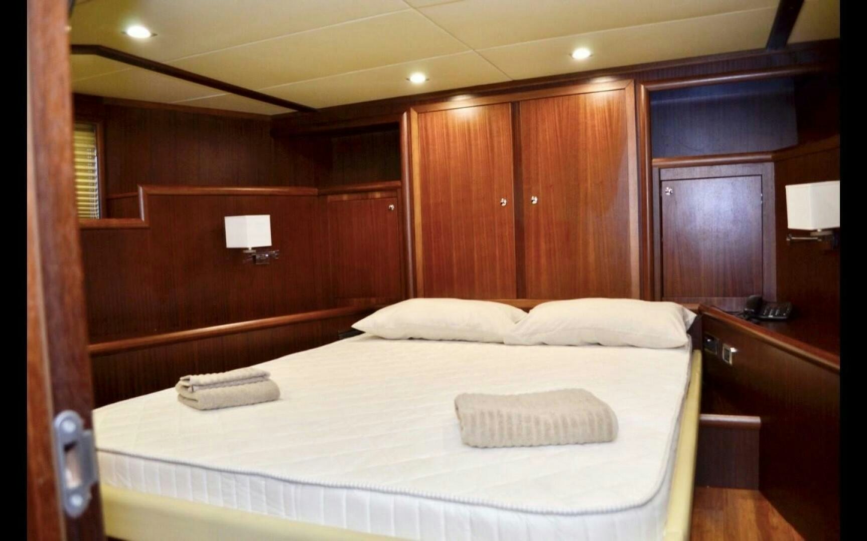 a bed in a room aboard MARILOAN FELNIC II Yacht for Sale