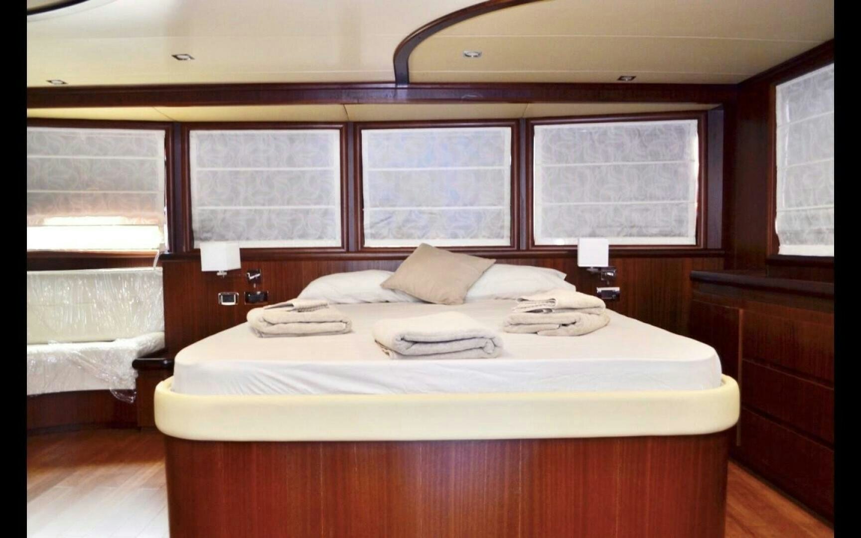 a bed in a room aboard MARILOAN FELNIC II Yacht for Sale