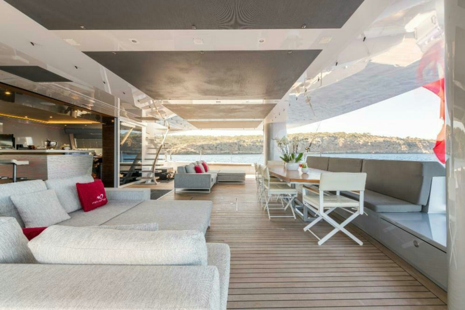 a room with a couch and a table and chairs aboard MOUSETRAP Yacht for Sale