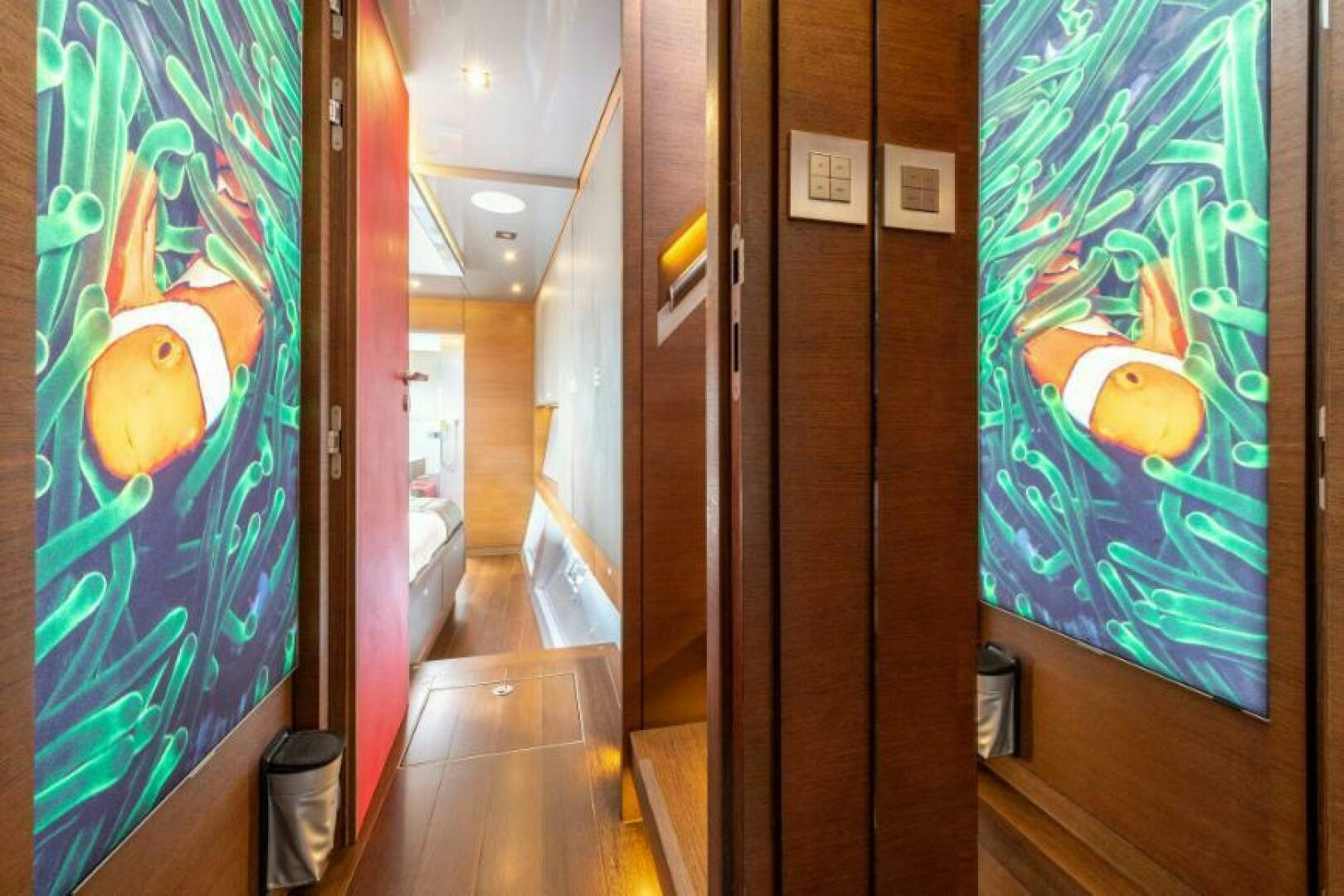 a hallway with art on the walls aboard MOUSETRAP Yacht for Sale