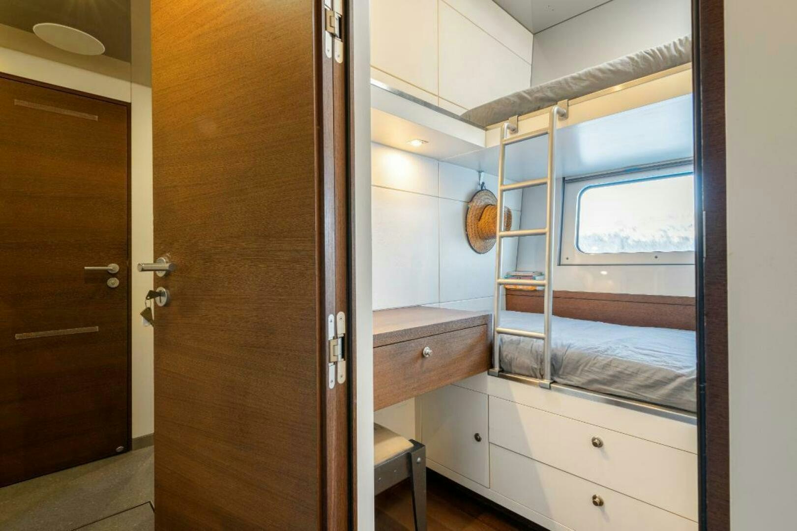 a room with a bed and a closet aboard MOUSETRAP Yacht for Sale