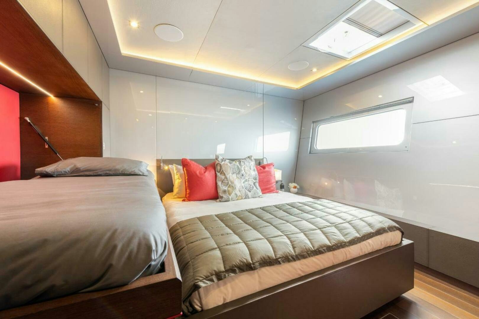 a couple of beds in a room aboard MOUSETRAP Yacht for Sale