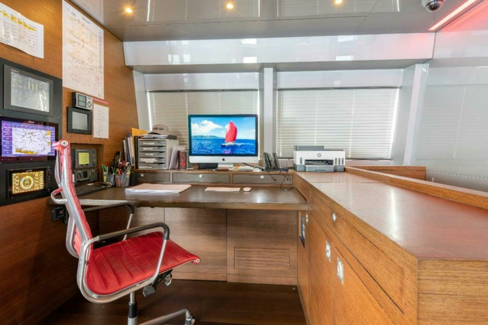 a room with a desk and chairs aboard MOUSETRAP Yacht for Sale