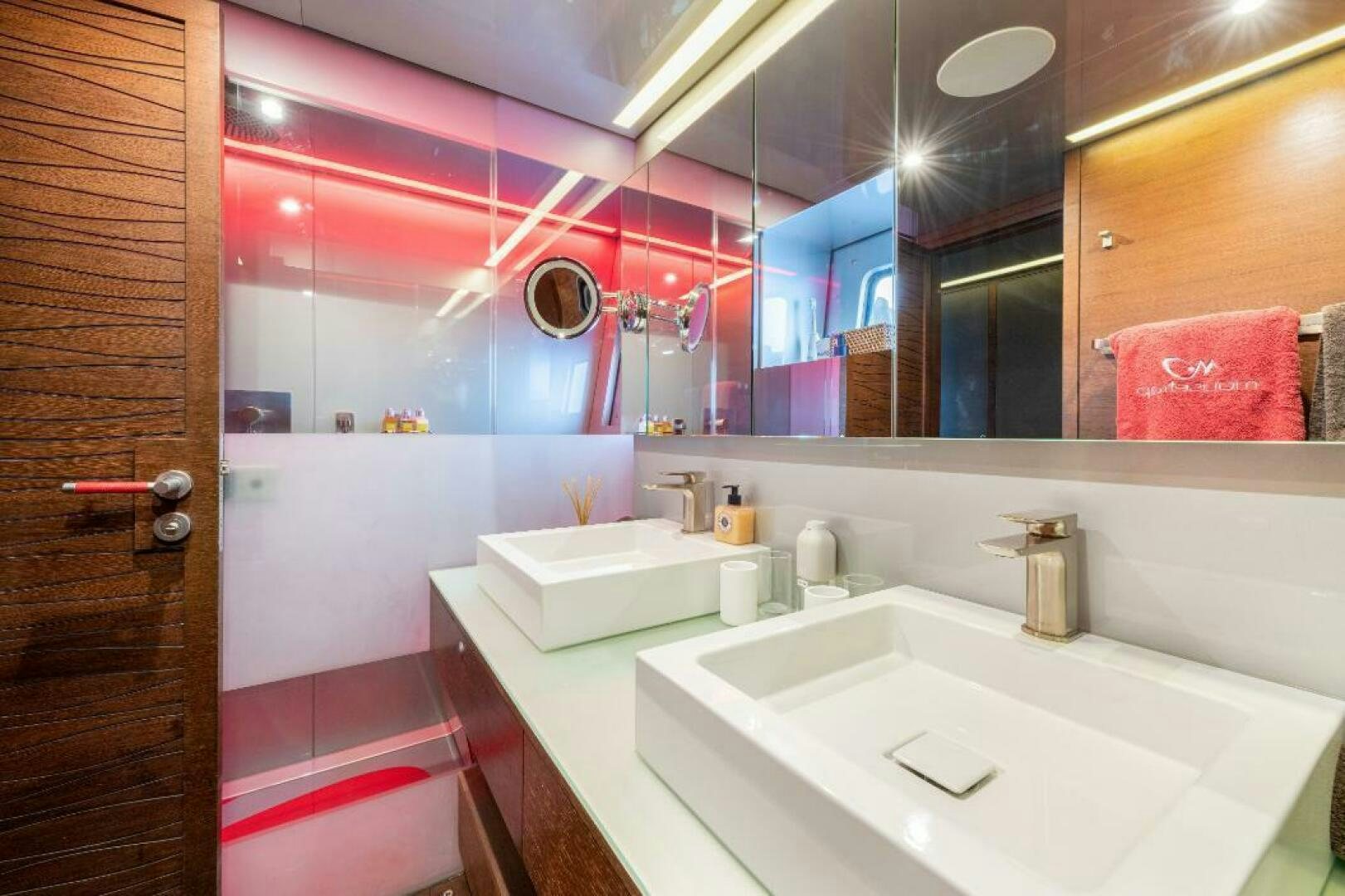 a bathroom with a large mirror aboard MOUSETRAP Yacht for Sale