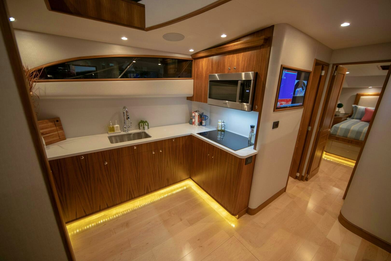 a kitchen with a sink and a microwave aboard PRIVATEER Yacht for Sale