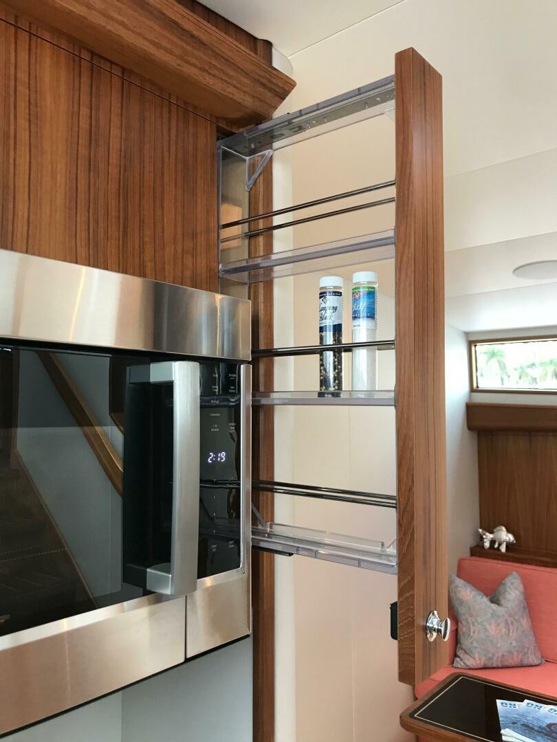 a refrigerator in a kitchen aboard PRIVATEER Yacht for Sale