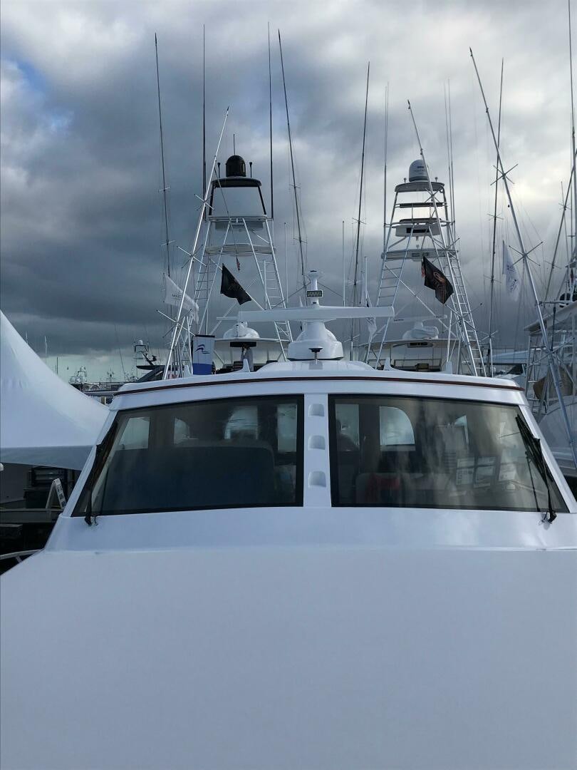 a white boat with a white sail aboard PRIVATEER Yacht for Sale