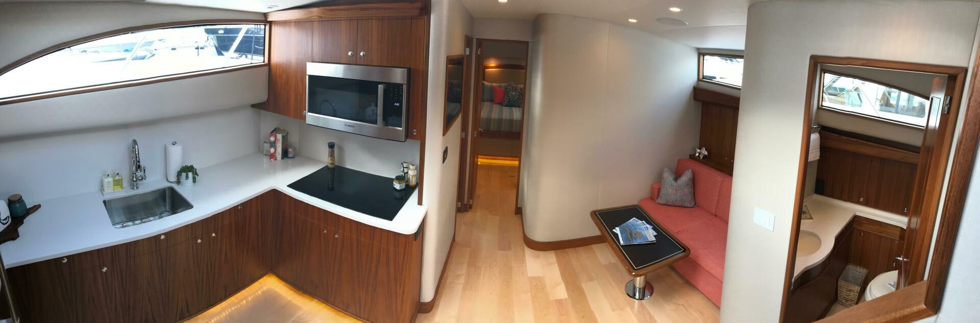 a kitchen with a sink and a microwave aboard PRIVATEER Yacht for Sale