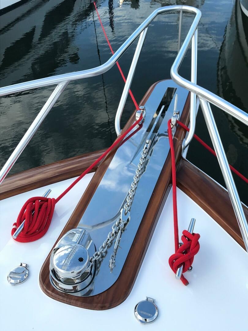 a red and white boat aboard PRIVATEER Yacht for Sale