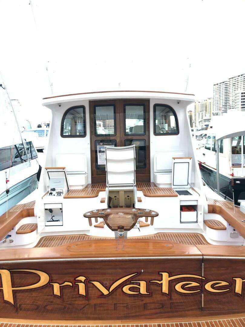 a display of a white vehicle aboard PRIVATEER Yacht for Sale