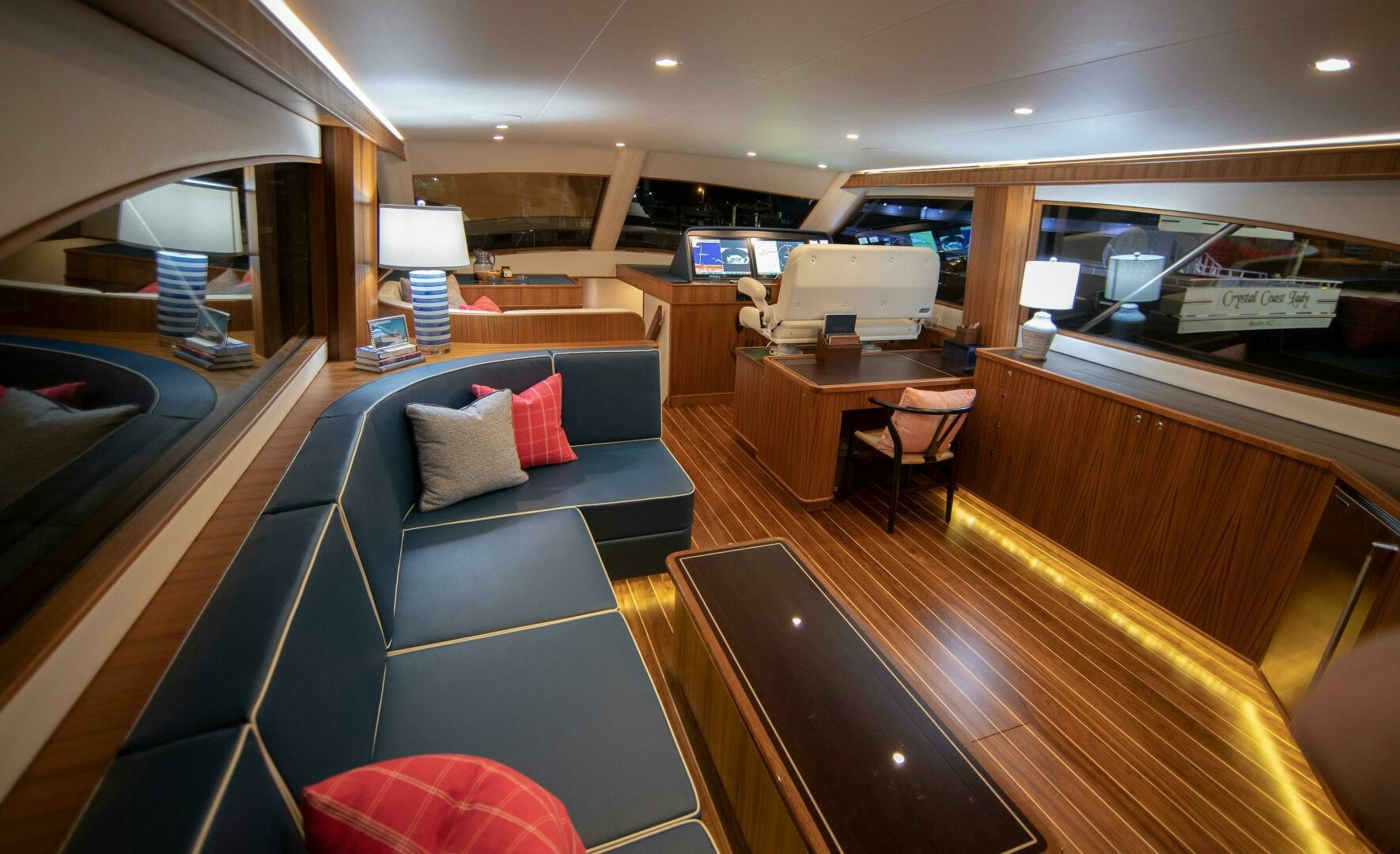 a room with a couch and a table aboard PRIVATEER Yacht for Sale