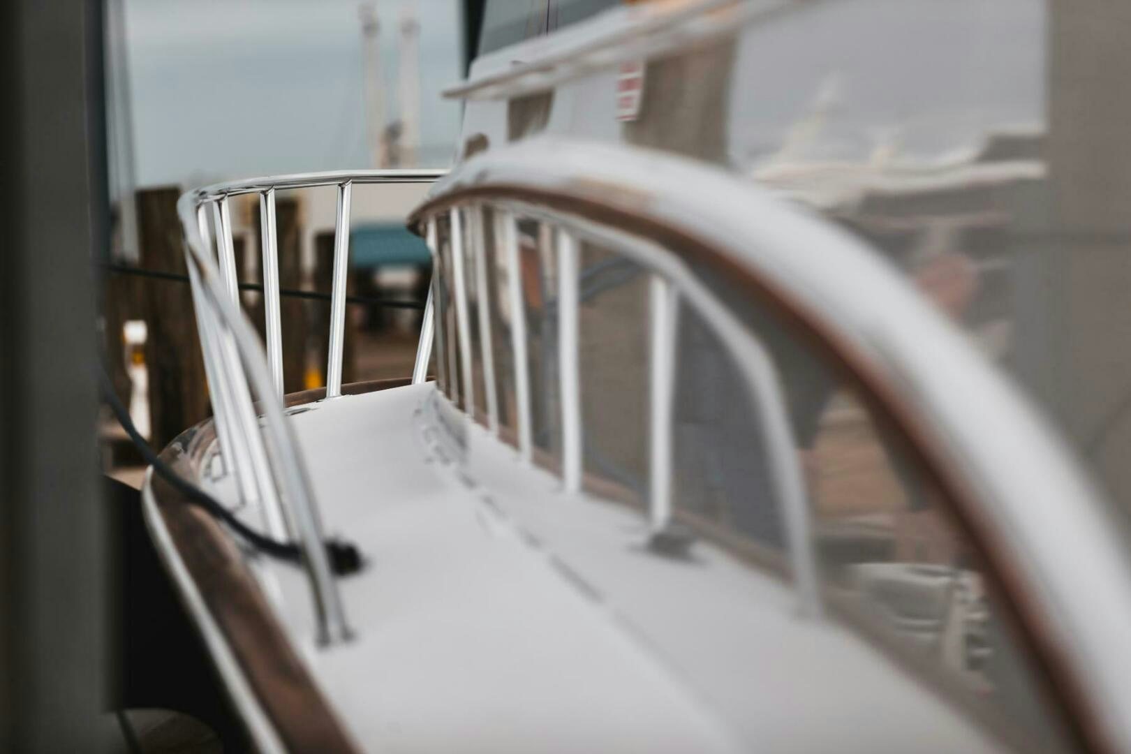 a white boat on a body of water aboard PRIVATEER Yacht for Sale