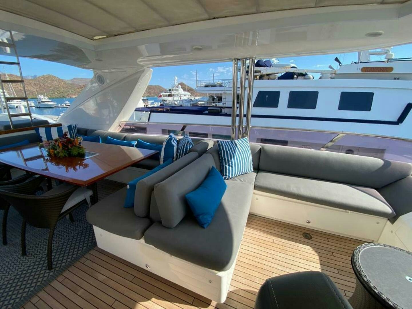 a boat with a table and chairs aboard PRINCESS TWO Yacht for Sale