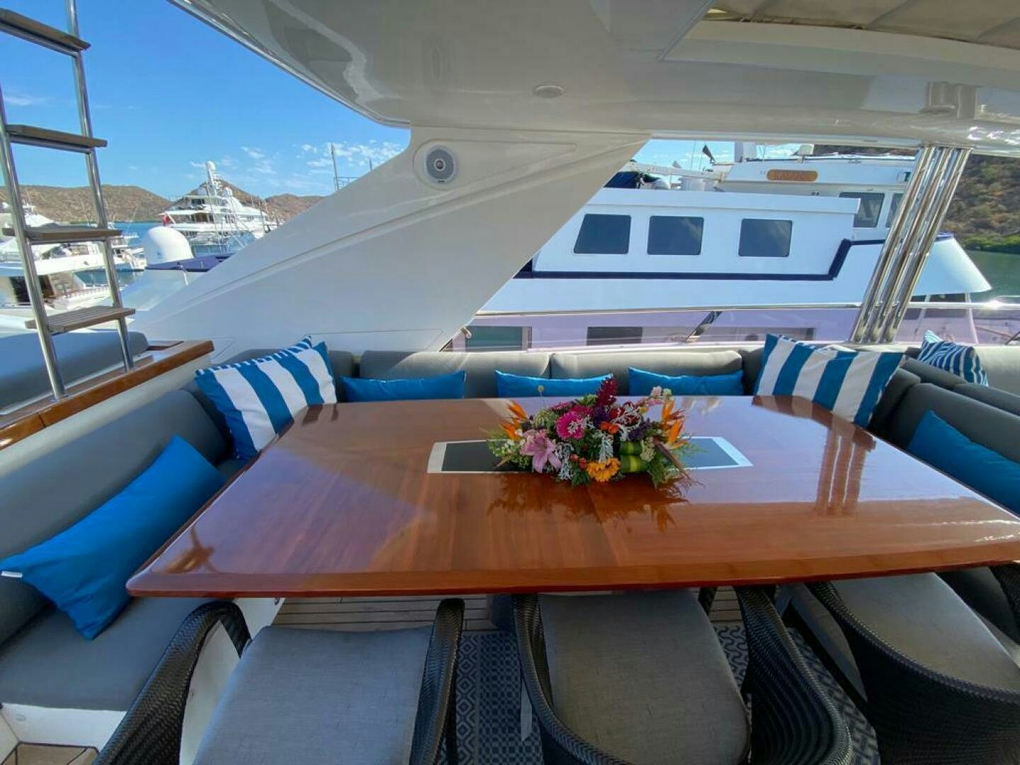a table with flowers on it aboard PRINCESS TWO Yacht for Sale