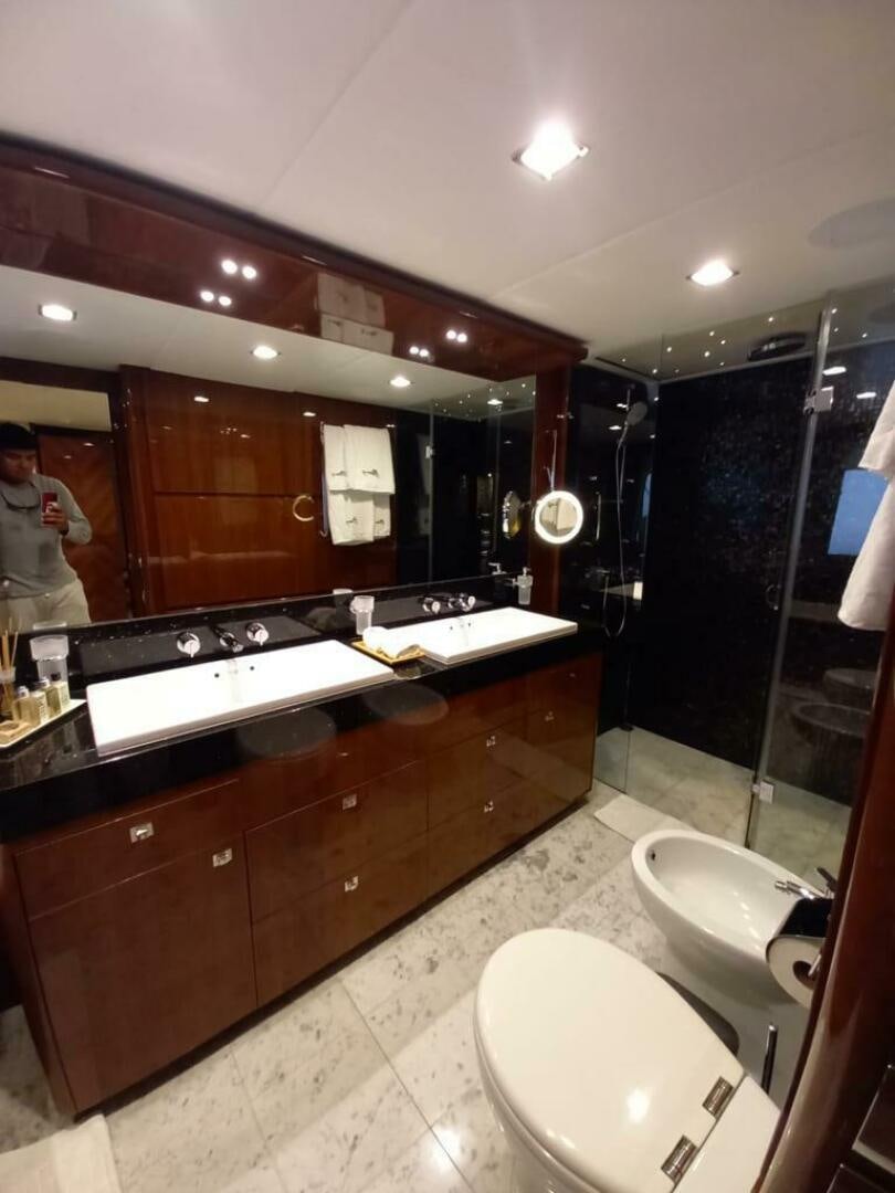 a bathroom with a large mirror aboard PRINCESS TWO Yacht for Sale