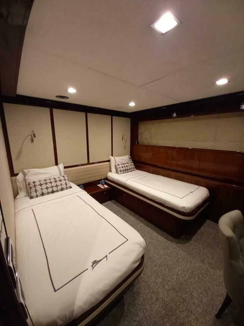 a room with two beds aboard PRINCESS TWO Yacht for Sale