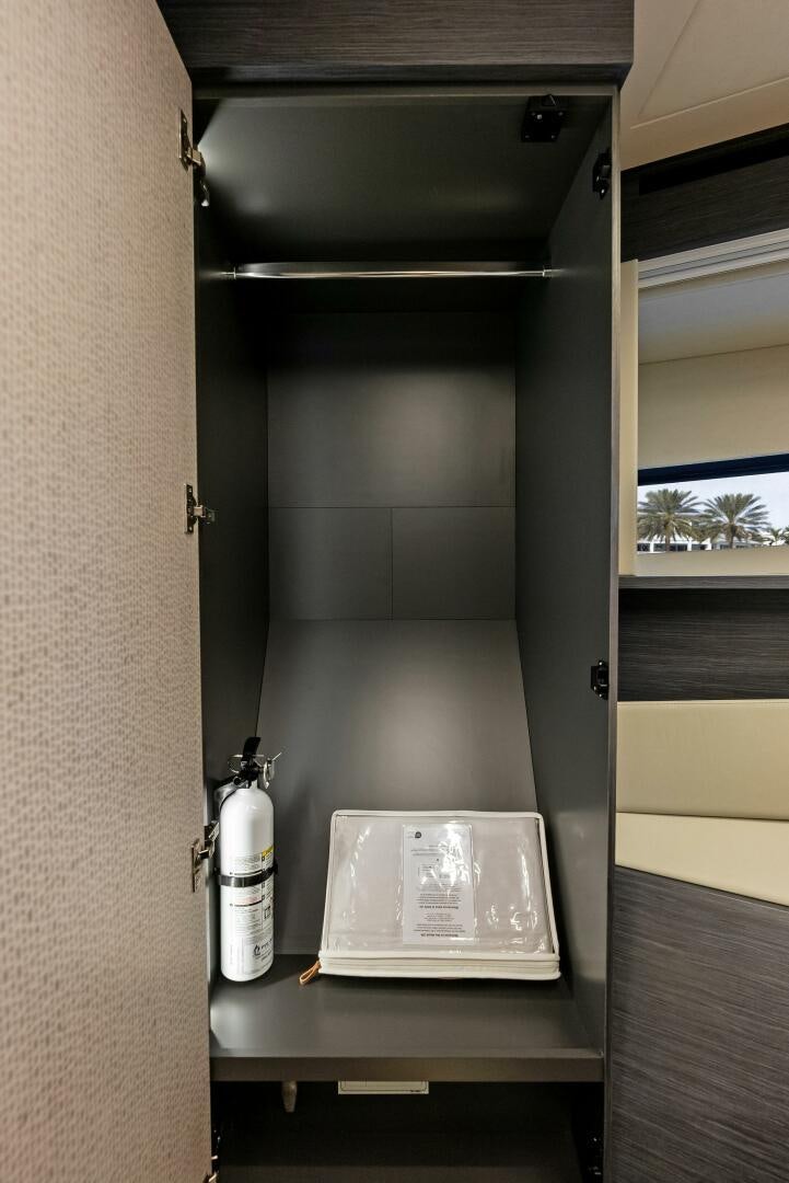 a book on a shelf aboard OUR TRADE Yacht for Sale