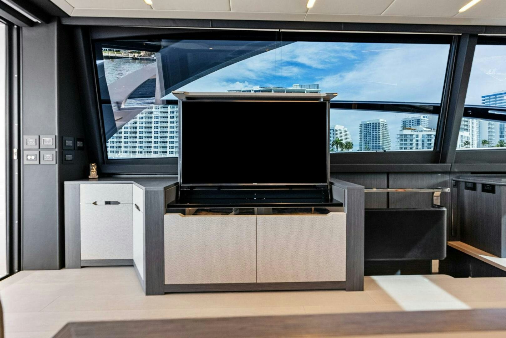a large tv in a room aboard OUR TRADE Yacht for Sale